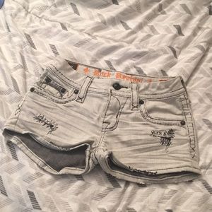 Rock Revival by Buckle women’s distressed light grey shorts